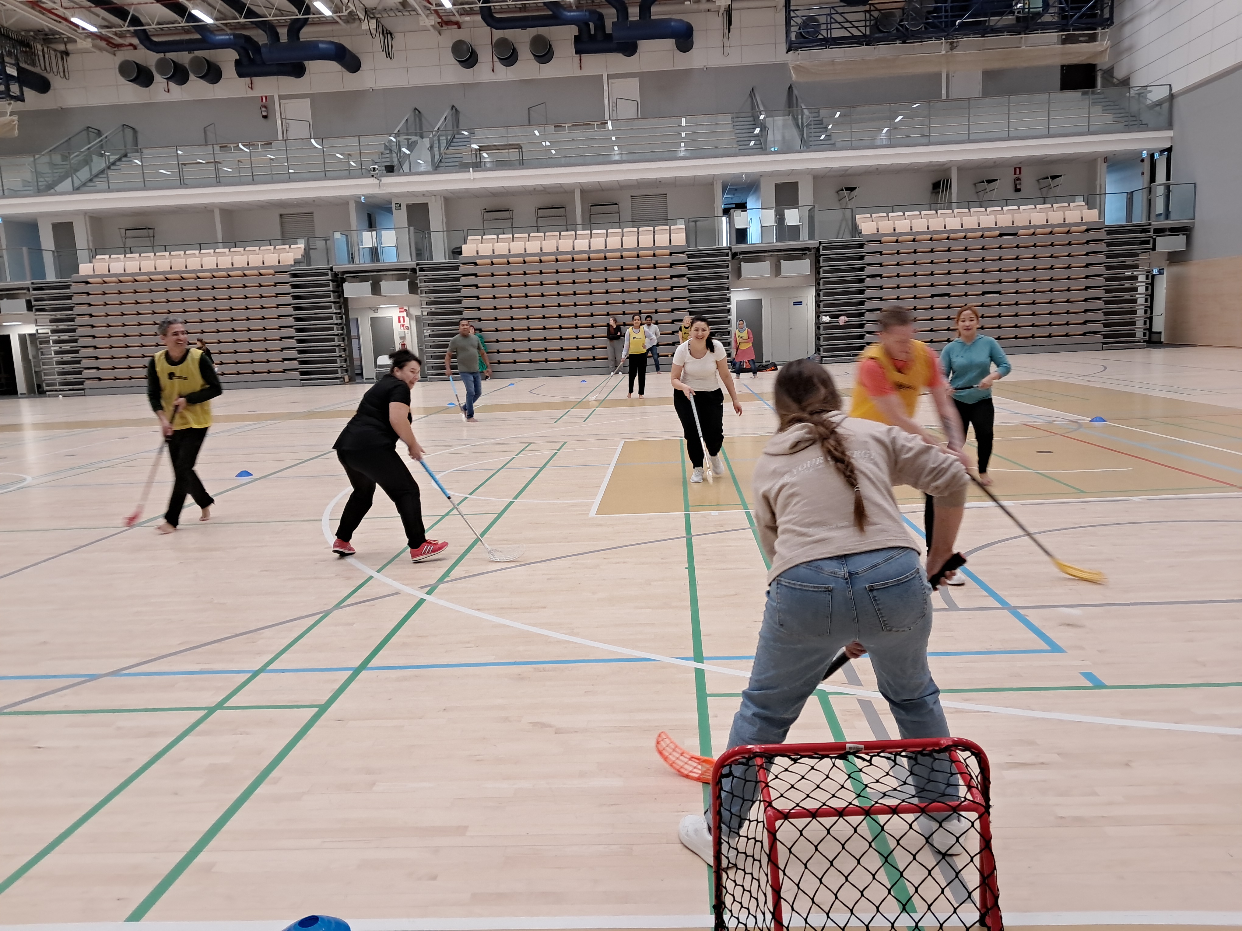 People playing floorball.